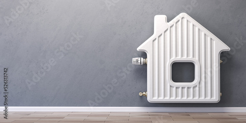 Home heating radiator in the form of house. photo