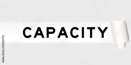 Ripped gray paper background that have word capacity under torn part
