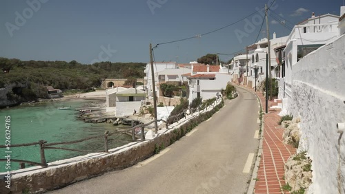 Turquoise water and whitewashed houses at Alcaufar, Menorca, Balearic Islands photo