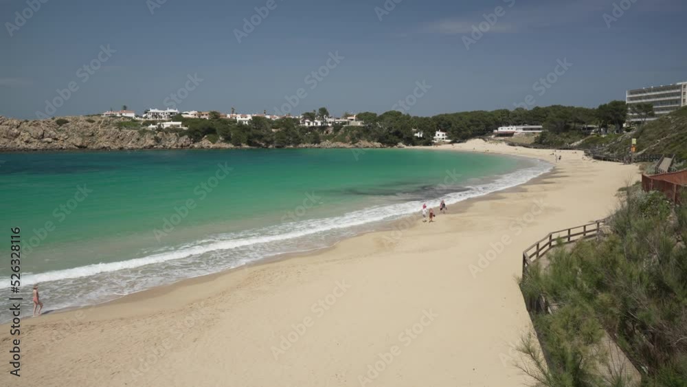 People walking on Platja Arenal d'en Castell Beach, Arenal d'en Castell, Menorca, Balearic Islands People walking on Platja Arenal d'en Castell Beach, Arenal d'en Castell, Menorca, Balearic Islands