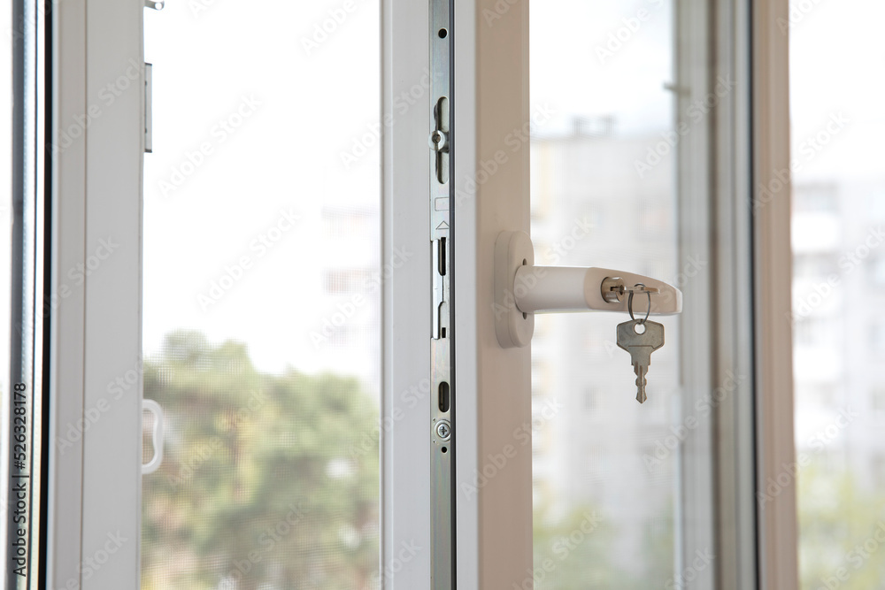 An open window on the balcony. Large window frame with light background. Ventilation of the room in summer in hot weather An open window on the balcony. Large window frame with light background. Ventilation of the room in summer in hot weather