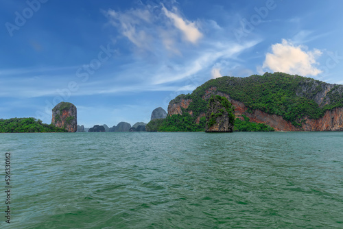 Phangna Bay near the Island of Phuket Thailand. Lovely rock in the middle of the ocean surrounded by mountains