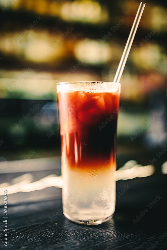 Cold drink with espresso and tonic in glass on bar Cold drink with espresso and tonic in glass on bar
