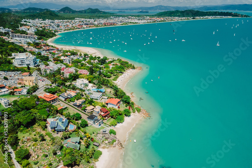 Tropical beach with Jurere town. Aerial view of Florianopolis photo