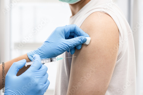 A man get covid 19 vaccine at hospital photo