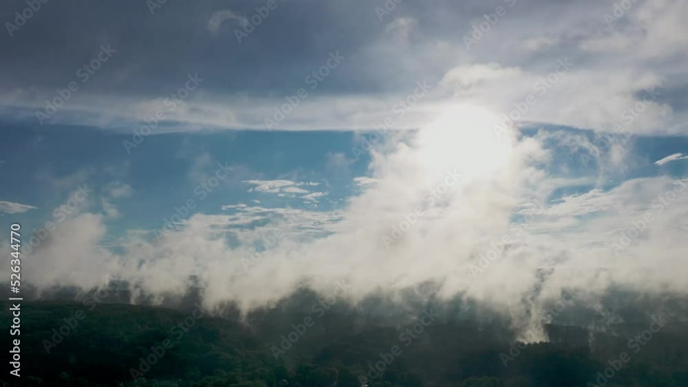 timelapse of mist rising over the forest with sun timelapse of mist rising over the forest with sun