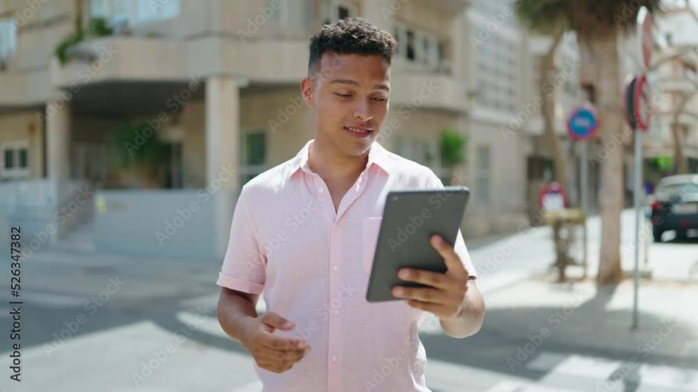 Young latin man smiling confident having video call at street Young latin man smiling confident having video call at street