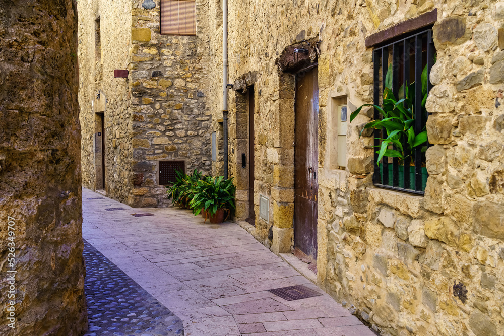 Medieval houses built of stone in narrow alleys in the tourist town of Besalu, Girona.
