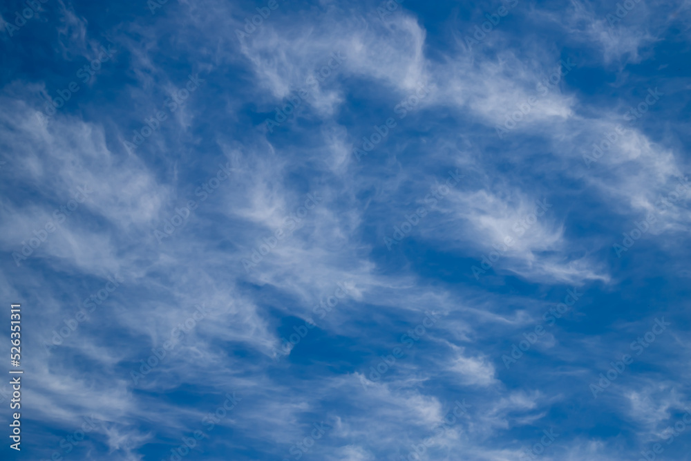 Blue sky cirrus clouds.