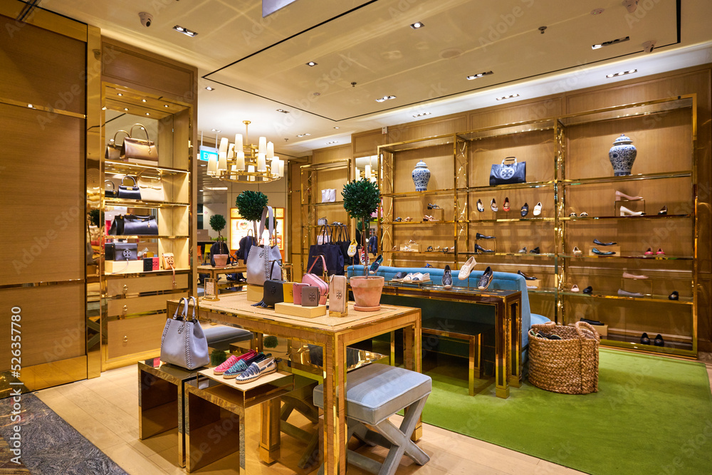 SINGAPORE - CIRCA JANUARY, 2020: bags on display at Tory Burch store in  Singapore Changi Airport. Stock Photo | Adobe Stock