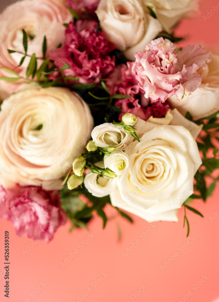 Bright pink flowers bouquet closeup. Roses and orchids wallpaper. Beautiful background for a Birthday, International Female Day, or Saint Valentine. The festive backdrop for a postcard design