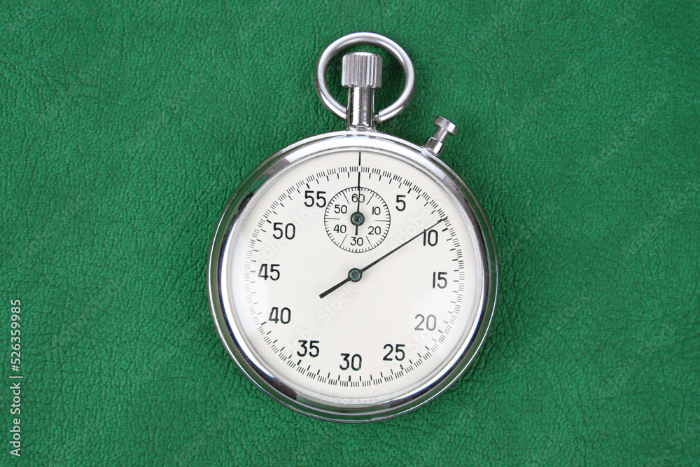 mechanical analog stopwatch on a colored background. Time part precision. Measurement of the speed interval mechanical analog stopwatch on a colored background. Time part precision. Measurement of the speed interval