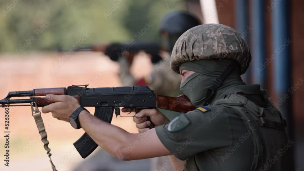 Defending the nation in a green uniform vest with a machine gun in hand, soldier holding a gun, military, army war concept, ready to attack, military machine gun crew shooting, army gunner attacking Defending the nation in a green uniform vest with a machine gun in hand, soldier holding a gun, military, army war concept, ready to attack, military machine gun crew shooting, army gunner attacking
