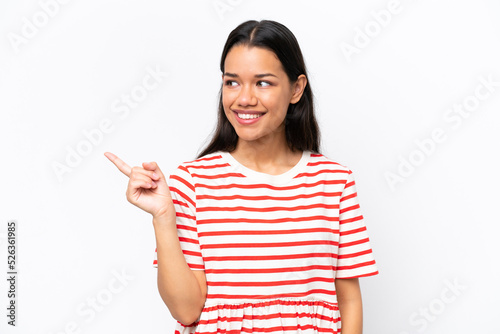 Young Colombian woman isolated on white background intending to realizes the solution while lifting a finger up