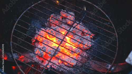 Burning charcoal on a grill