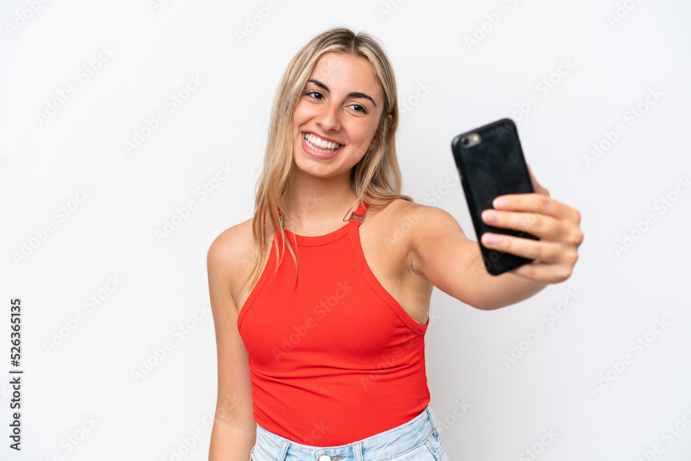 Young caucasian woman isolated on white background making a selfie Young caucasian woman isolated on white background making a selfie