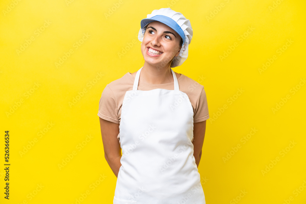 Fishwife woman over isolated background thinking an idea while looking up Fishwife woman over isolated background thinking an idea while looking up