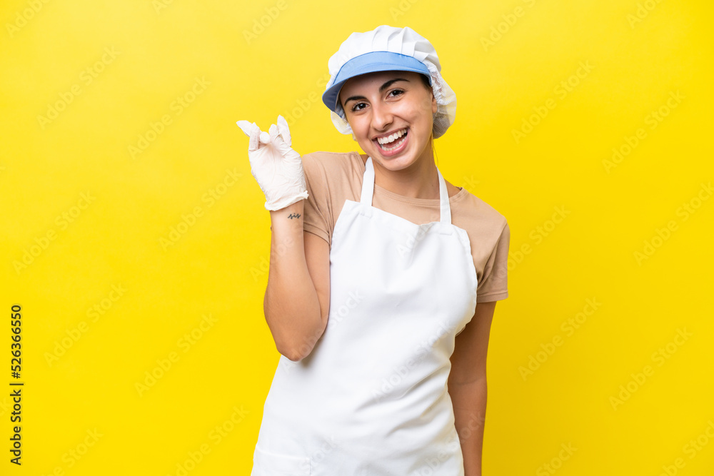 Fishwife woman over isolated background smiling and showing victory sign