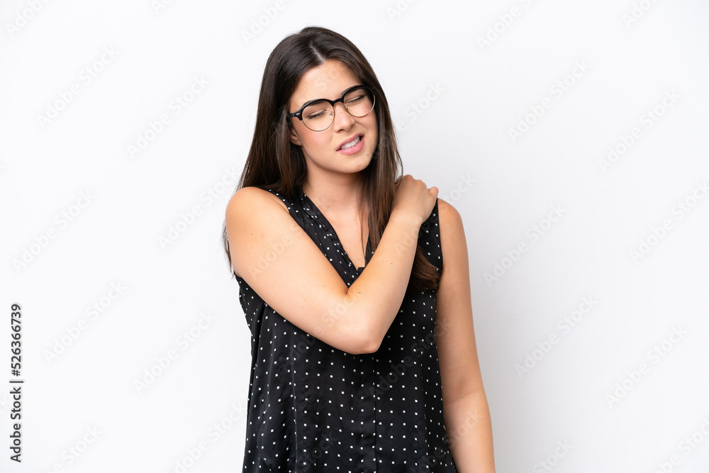Young Brazilian woman isolated on white background suffering from pain in shoulder for having made an effort Young Brazilian woman isolated on white background suffering from pain in shoulder for having made an effort