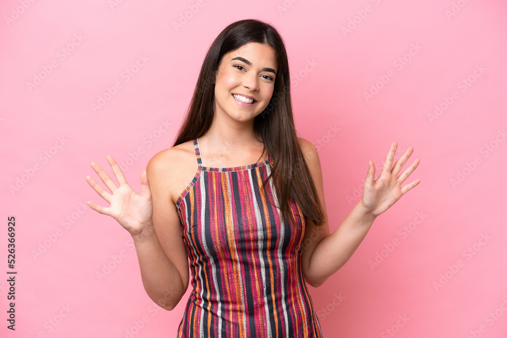 Young Brazilian woman isolated on pink background counting ten with fingers Young Brazilian woman isolated on pink background counting ten with fingers