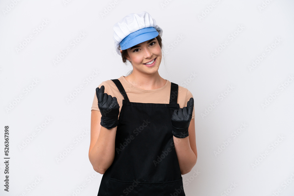 Fishmonger brazilian woman wearing an apron isolated on white background making money gesture Fishmonger brazilian woman wearing an apron isolated on white background making money gesture