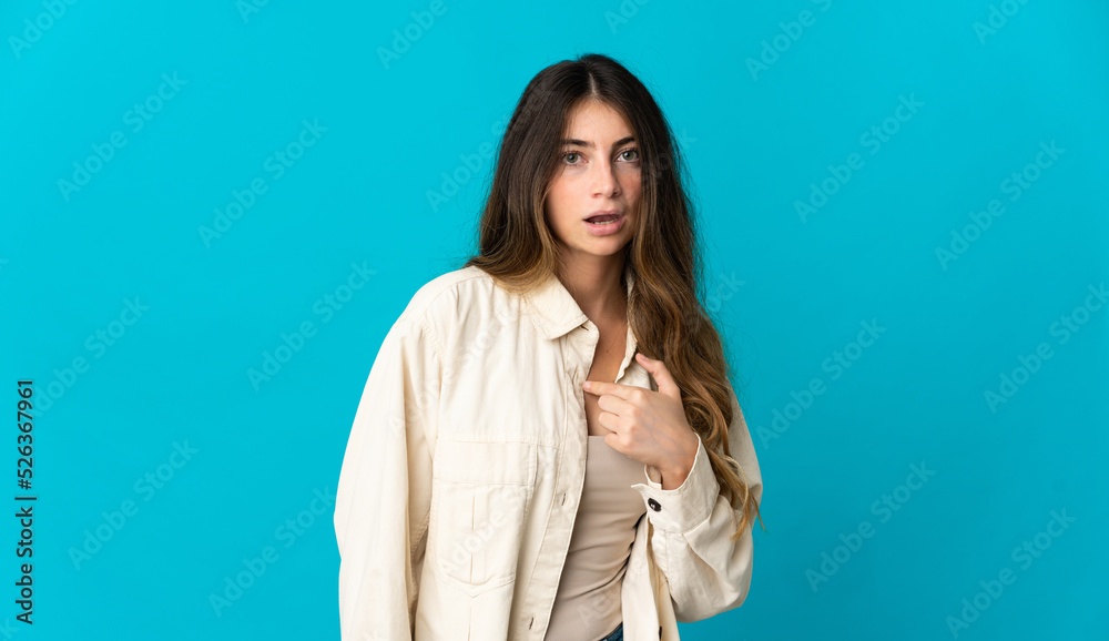 Young caucasian woman isolated on blue background pointing to oneself Young caucasian woman isolated on blue background pointing to oneself
