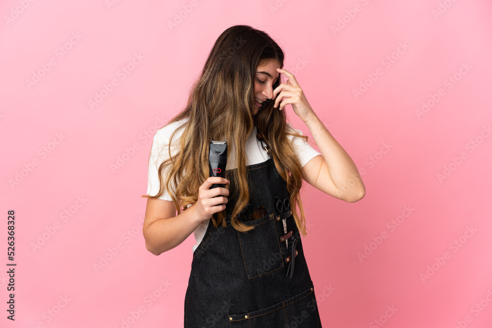 Young hairdresser woman isolated on pink background laughing Young hairdresser woman isolated on pink background laughing