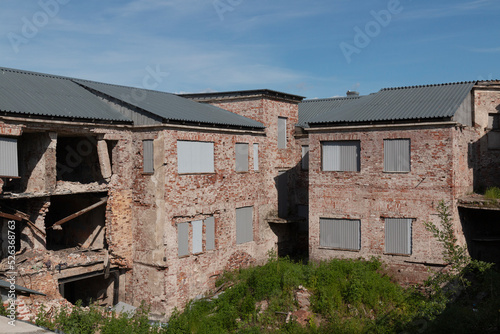 Ruins of an abandoned building by summer day