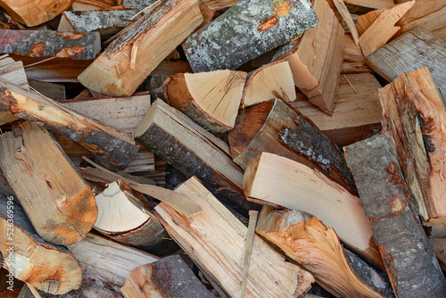 chopped firewood. preparation for the heating season. energy. background.