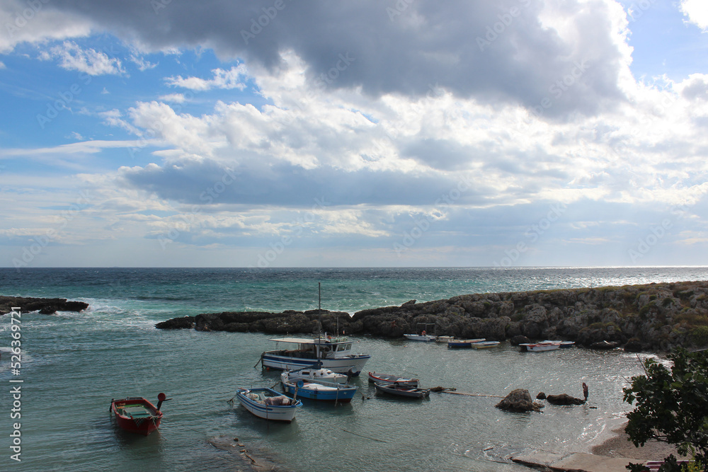 boats in a small harbor in southern italy