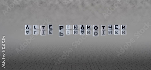 alte pinakothek Wort oder Konzept dargestellt durch schwarze und weiße Buchstabenwürfel auf einem grauen Horizonthintergrund photo