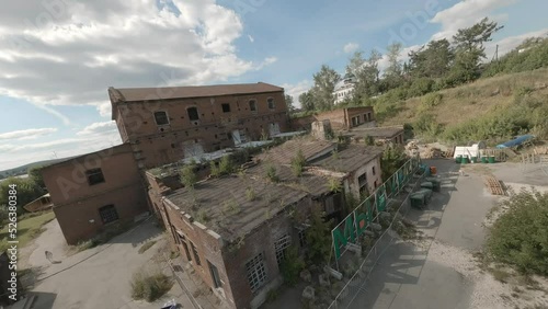 FPV drone view of old ruined factory for events, holidays and performances. Art space and installations.
 photo