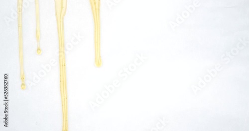 dripping drops of golden cannabis wax, marijuana extract rosin on a white background. High quality 4k footage