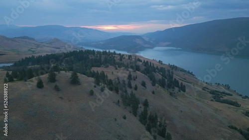 Aerial View of Canadian Landscape with Kalamalka Lake and Mountains. Colorful Cloudy Summer Sunrise. Near Vernon, Okanagan, BC, Canada. Nature Background.