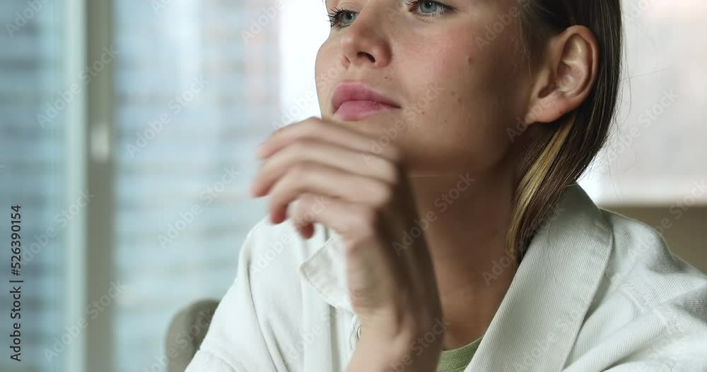 Serious thoughtful beautiful young Caucasian woman sitting on sofa at home, leaning chin on hand, looking away , thinking, pondering, dreaming, keeping silence. Decision making, beauty care concept Serious thoughtful beautiful young Caucasian woman sitting on sofa at home, leaning chin on hand, looking away , thinking, pondering, dreaming, keeping silence. Decision making, beauty care concept