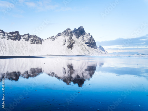 Wallpaper Mural Stokksness, Vestrahorn National Park, Iceland. Wide beach with black volcanic sand. Reflections on the seashore at high tide. View of Iceland's nature in winter time. Torontodigital.ca