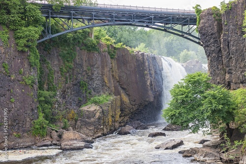 Beautiful landscape of the walking bridge near the Great Falls of the Passaic River in New Jersey photo