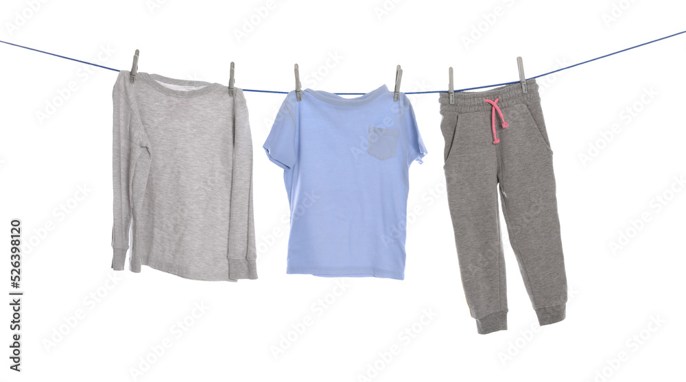 Different clothes drying on washing line against white background Different clothes drying on washing line against white background