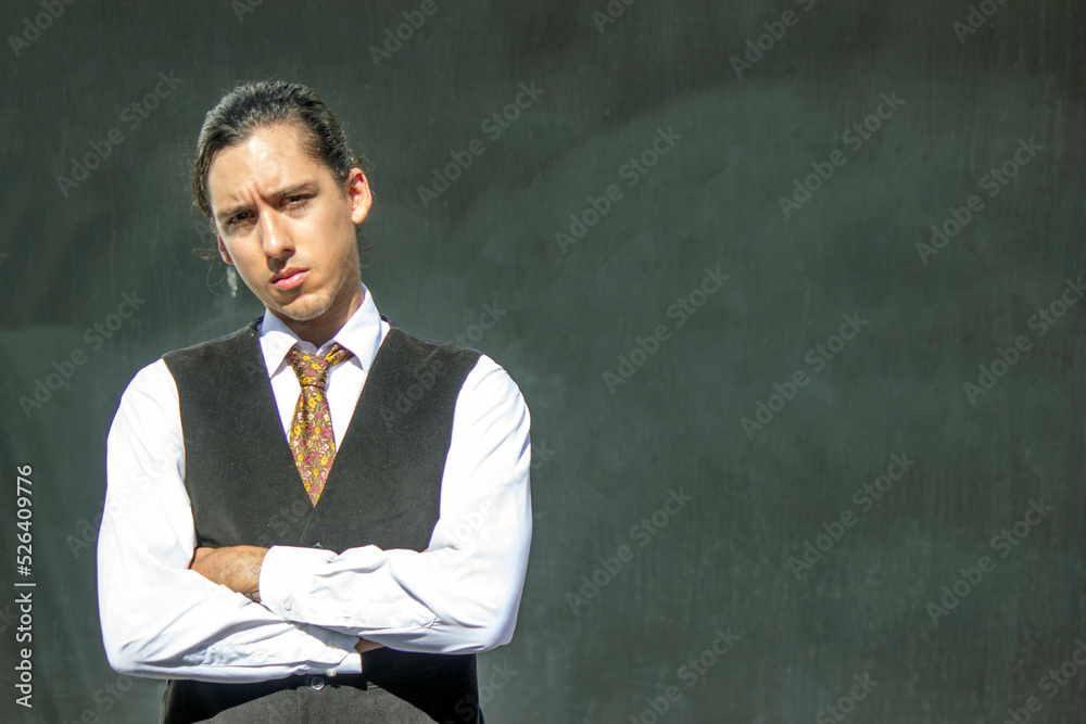 Handsome and elegant Latin American young man poses outdoors with solid backgrounds for design, with great attitude in Venezuela Handsome and elegant Latin American young man poses outdoors with solid backgrounds for design, with great attitude in Venezuela