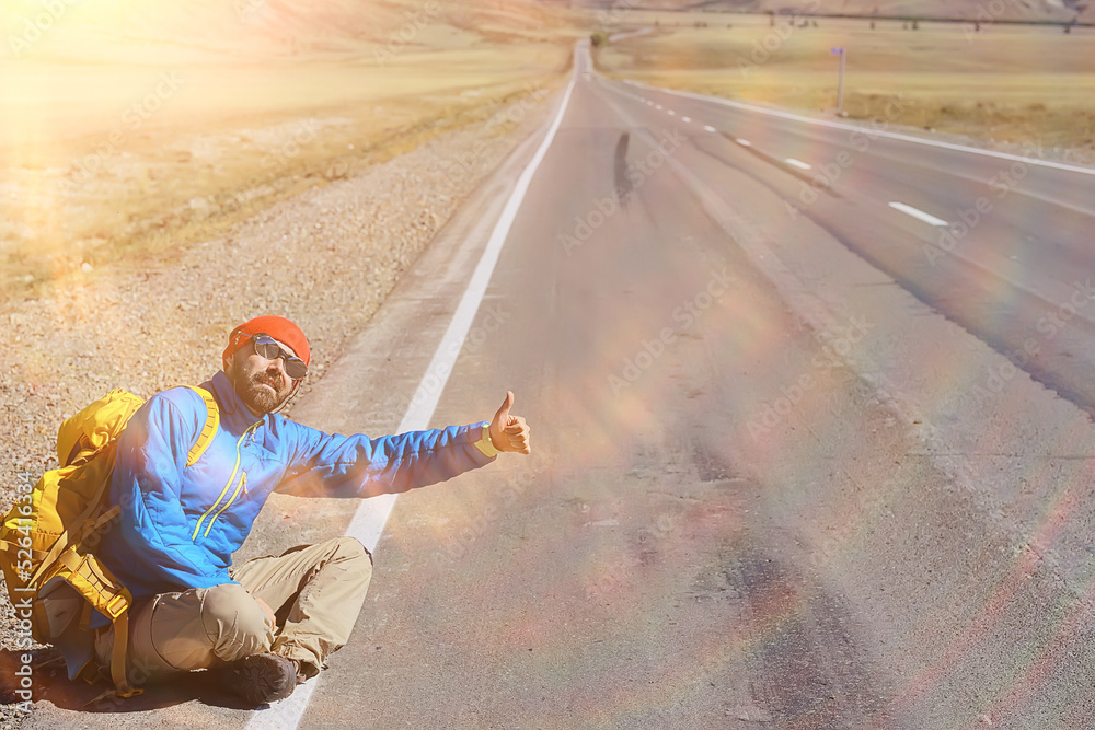 hiker with backpack on the highway hitchhiking, travel activity trip hiker with backpack on the highway hitchhiking, travel activity trip