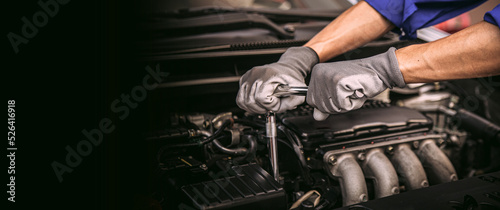 Car care maintenance and servicing, Close-up hand technician auto mechanic using the wrench to repairing change spare part car engine problem and car insurance service support.
