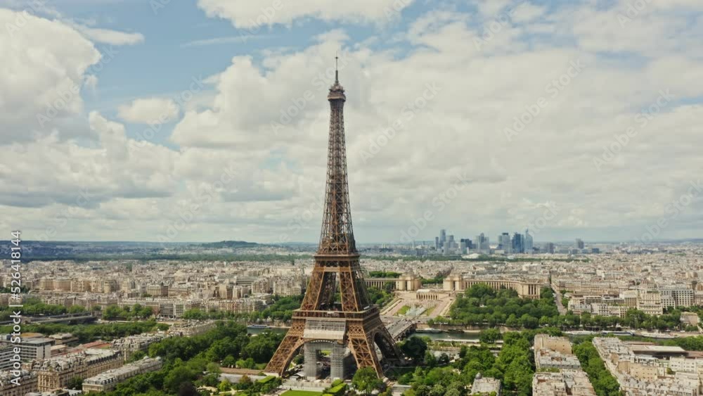 Close-up of the Eiffel Tower during restoration. Bird's eye view video from a drone on a cloudy day, Paris, France