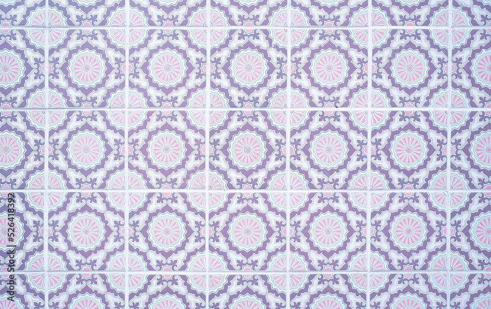 Old traditional Portuguese purple and pink ceramic tiles wall pattern background