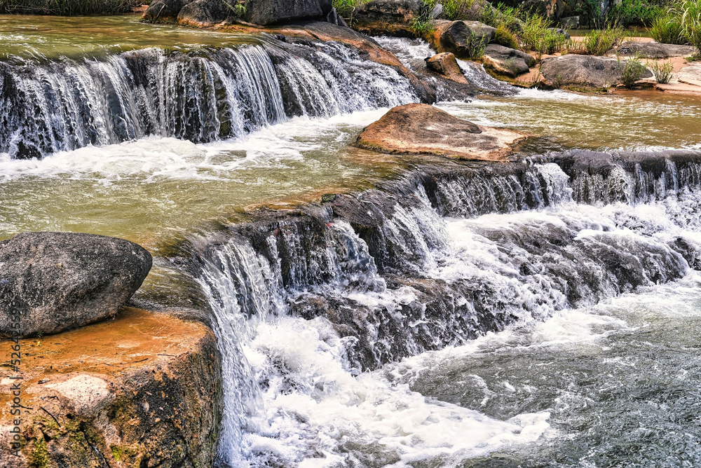 Fototapeta premium Small waterfall with clear water closeup