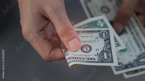 Young man with dollar banknote which he is show of money and exchanging money while could be used for anything from business image