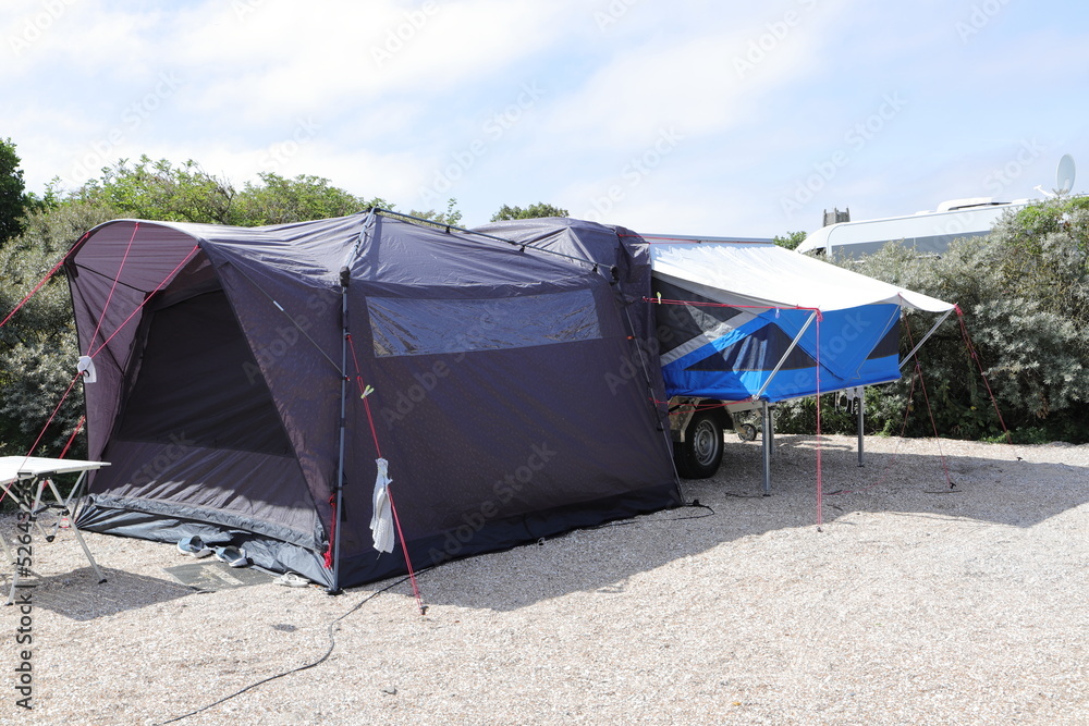 an folding caravan on a campsite  - obrazy, fototapety, plakaty 