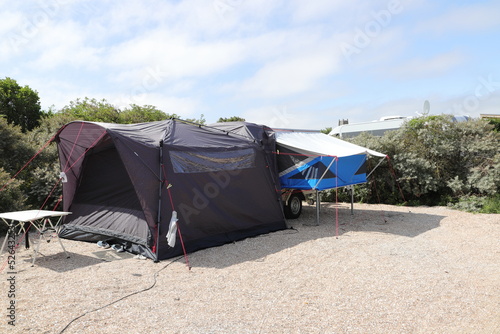 an folding caravan on a campsite 