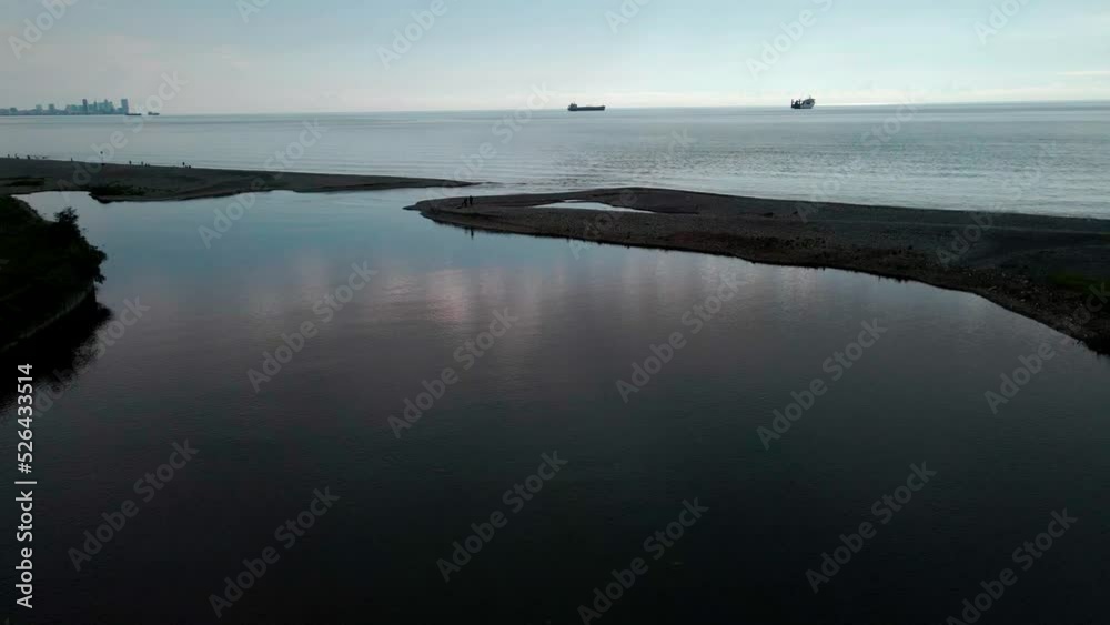 Black Sea beach and embankment with vacationers and infrastructure. Drone flight over Ureki. Black Sea beach and embankment with vacationers and infrastructure. Drone flight over Ureki.