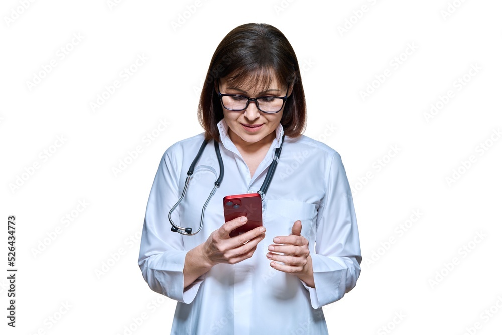 Woman doctor with smartphone on white background Woman doctor with smartphone on white background