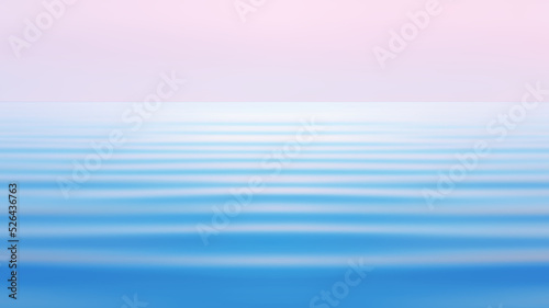 Light pink sky over the blue calm waves of the sea tide. Abstract pastel seascape background in watercolor tones with space for copy and design. Tinted, motion blur filter.